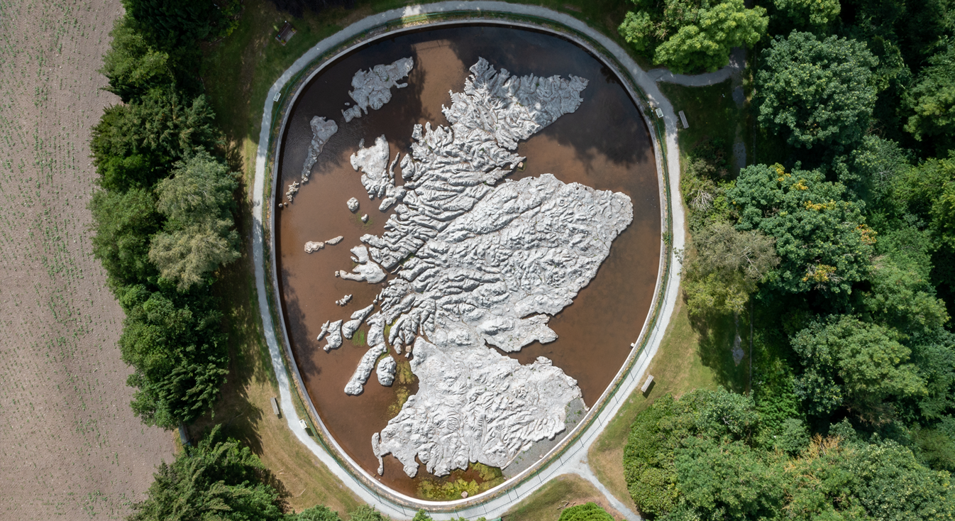 A map of Scotland inside a small water feature