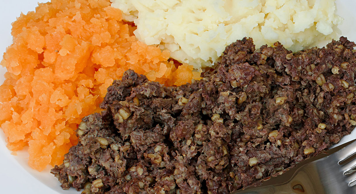 Haggis, neeps and tatties on a plate