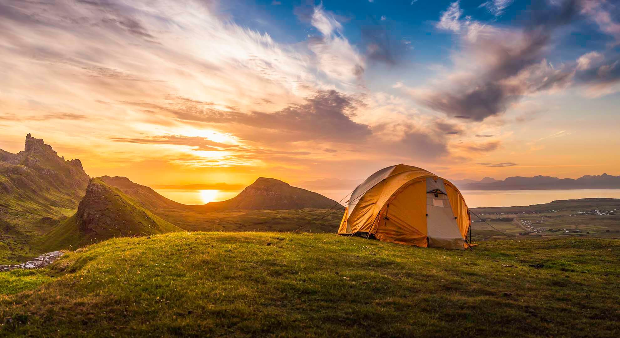 a tent pitched on a hill
