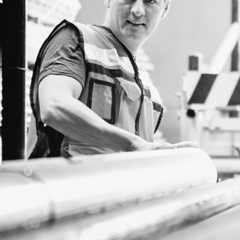 A person standing in front of steel beams
