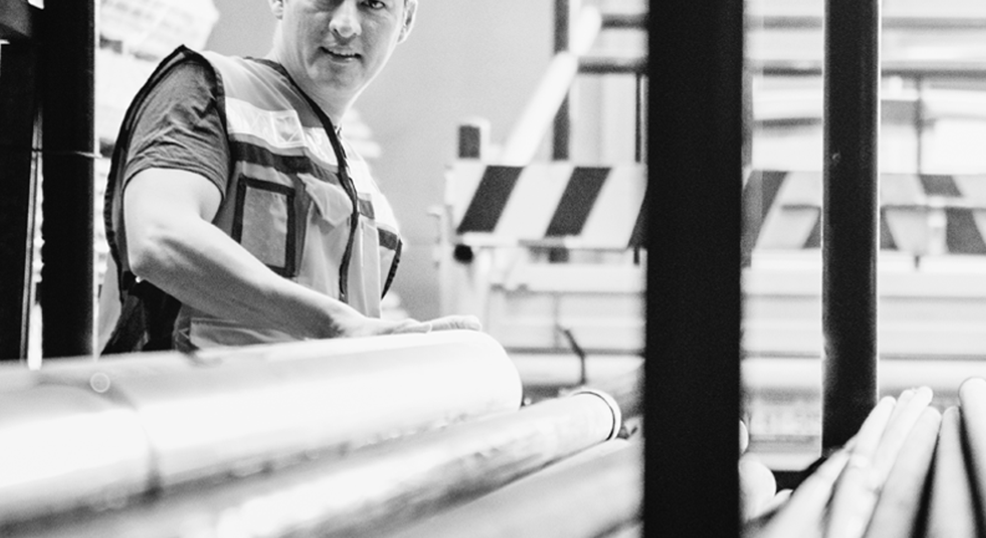 A person standing in front of steel beams