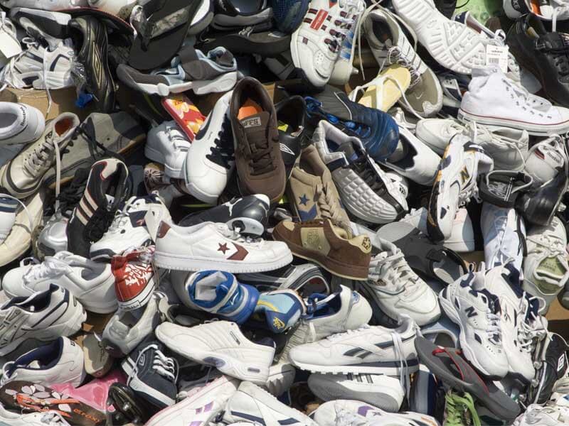 A large pile of old shoes