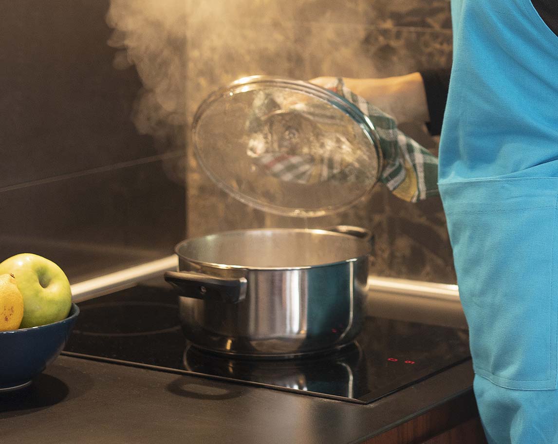 a steaming pot on a kitchen hob