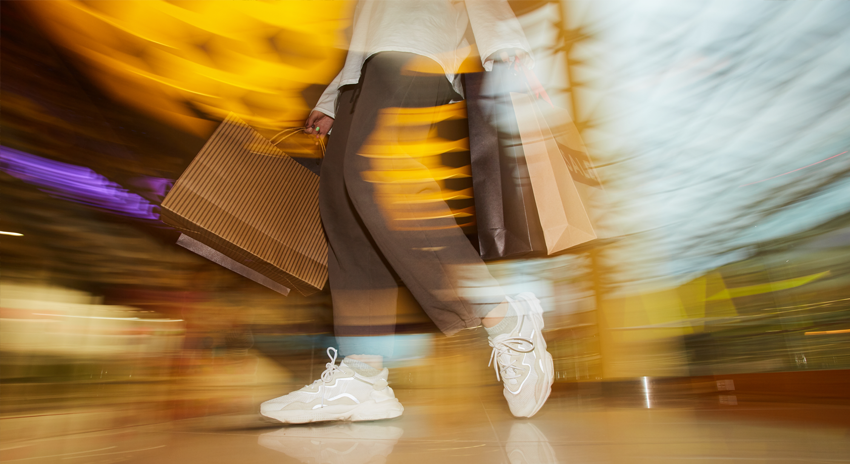 An abstract image showing a person clothes shopping