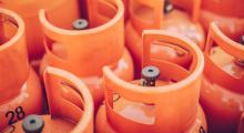 A group of orange gas canisters 