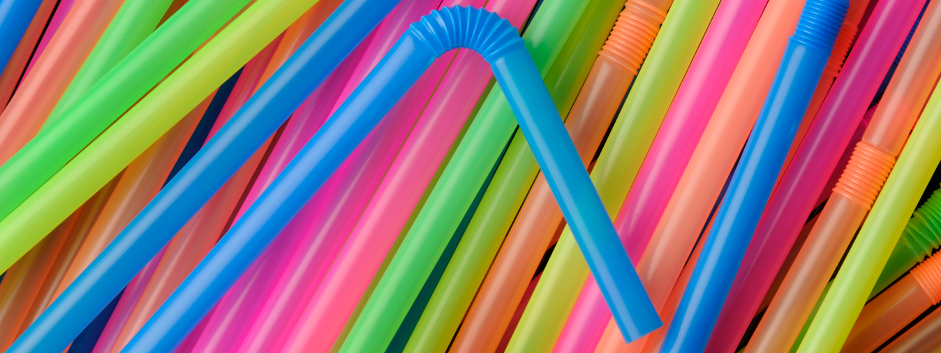 A pile of multi coloured plastic straws