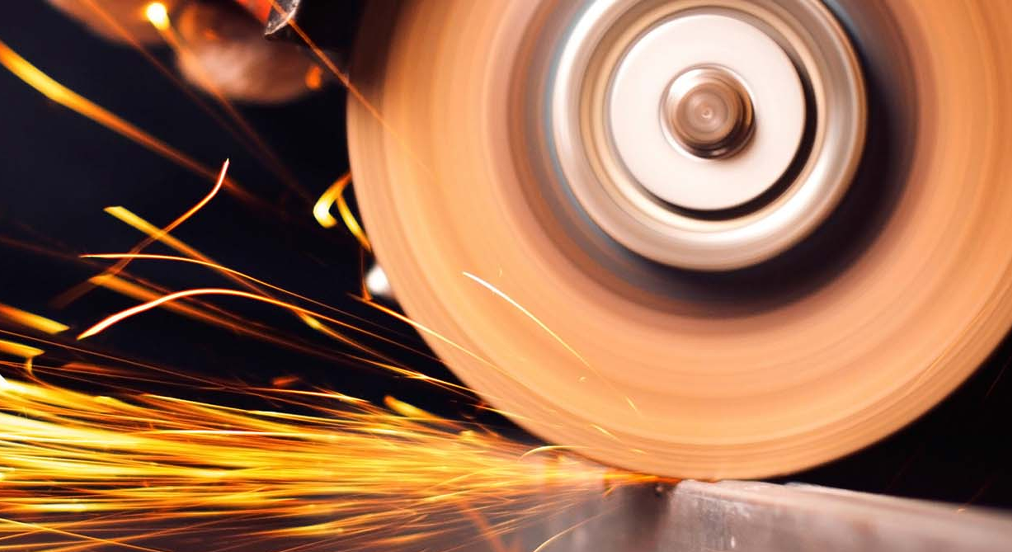 Grinder shaping metal with sparks 