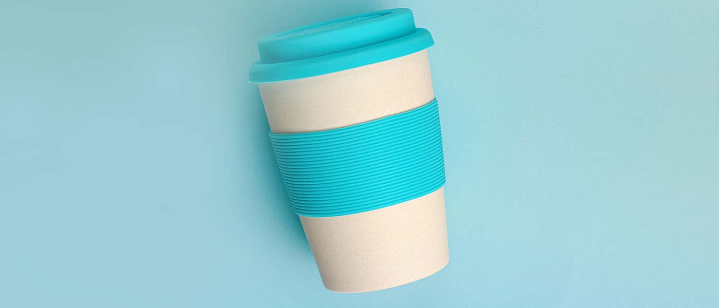 Photo of a reusable cup on a light blue background