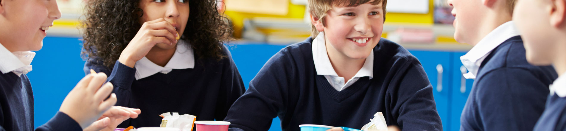 Children eating lunch in school