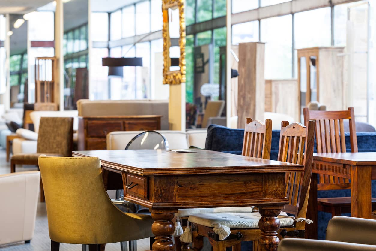 An antique table with different chairs