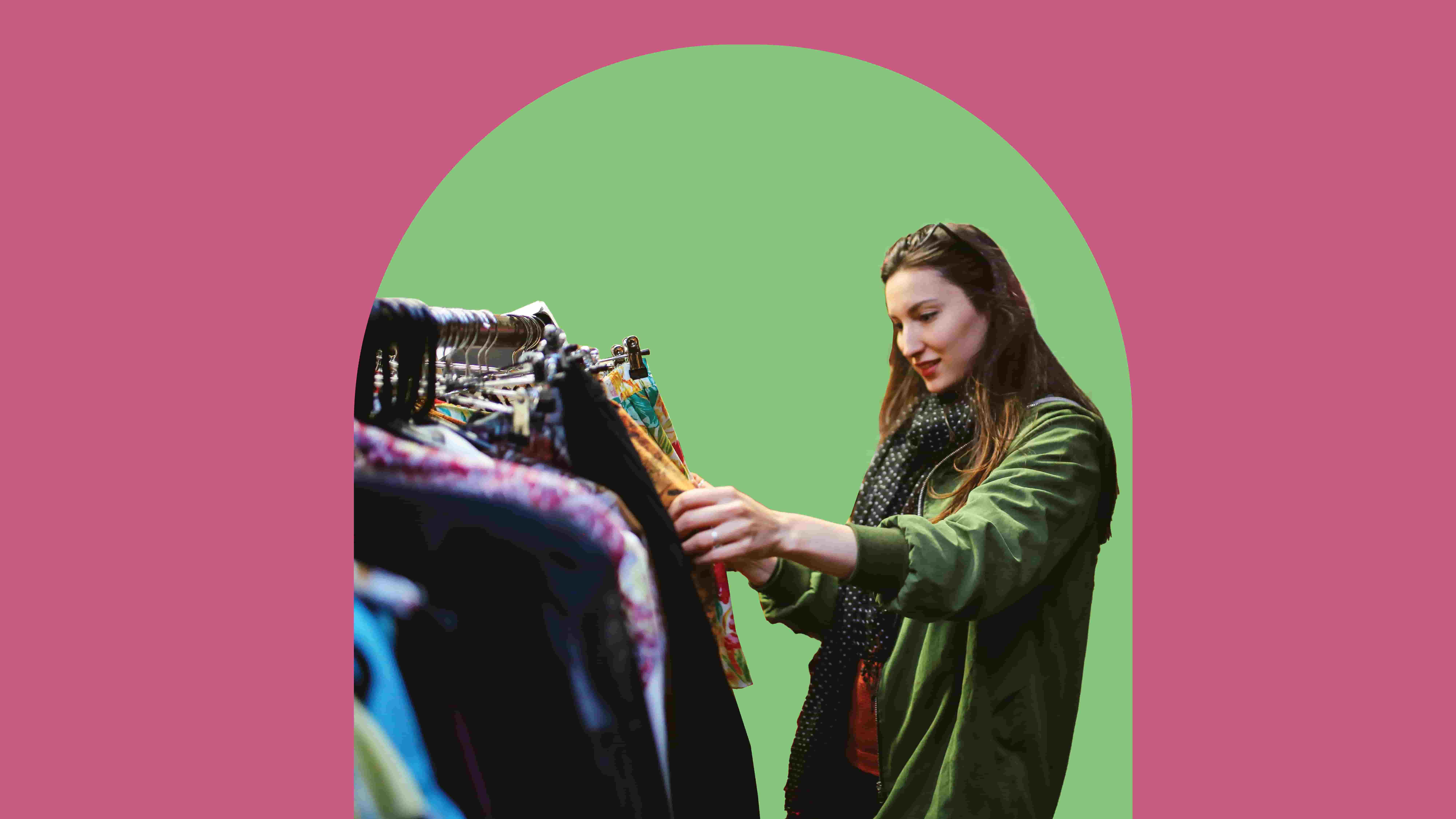 pink banner with person looking at a rail of clothing