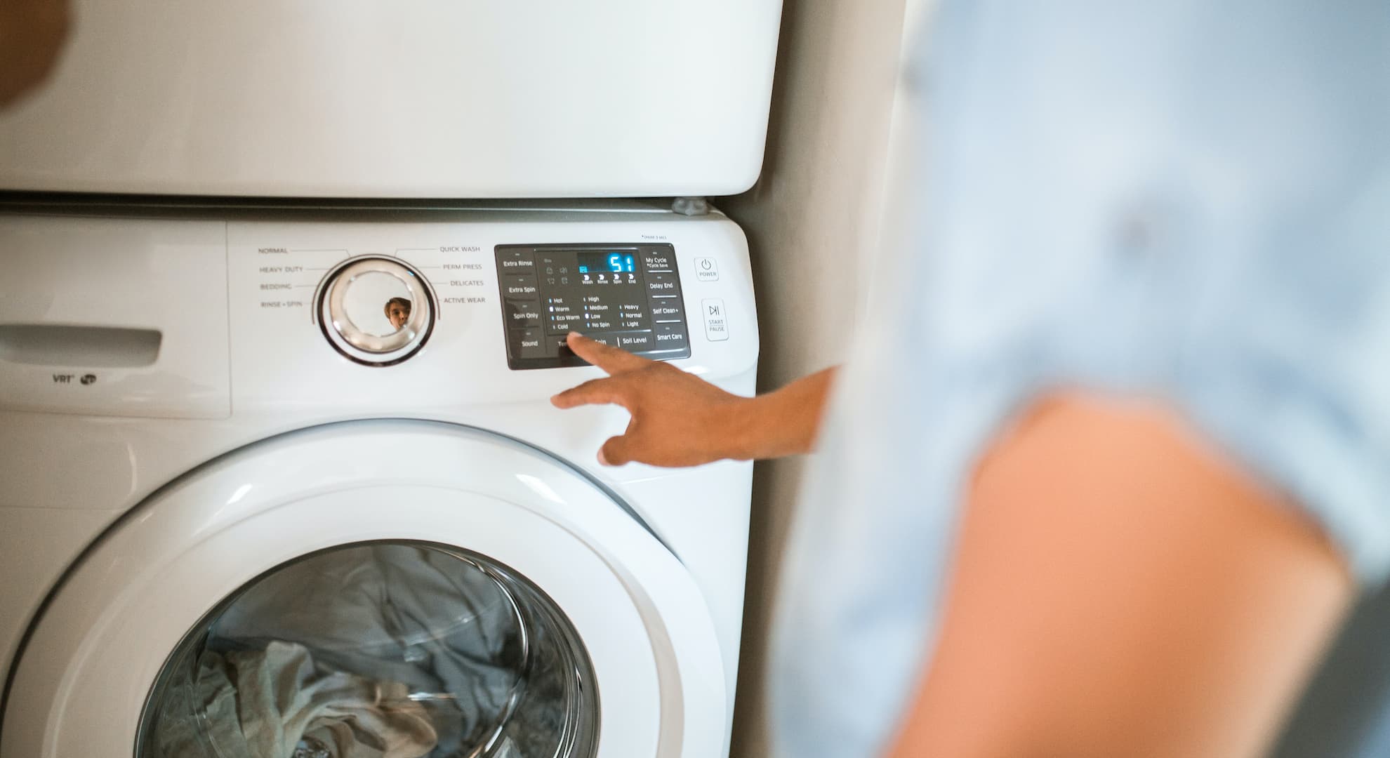Person using a washing machine