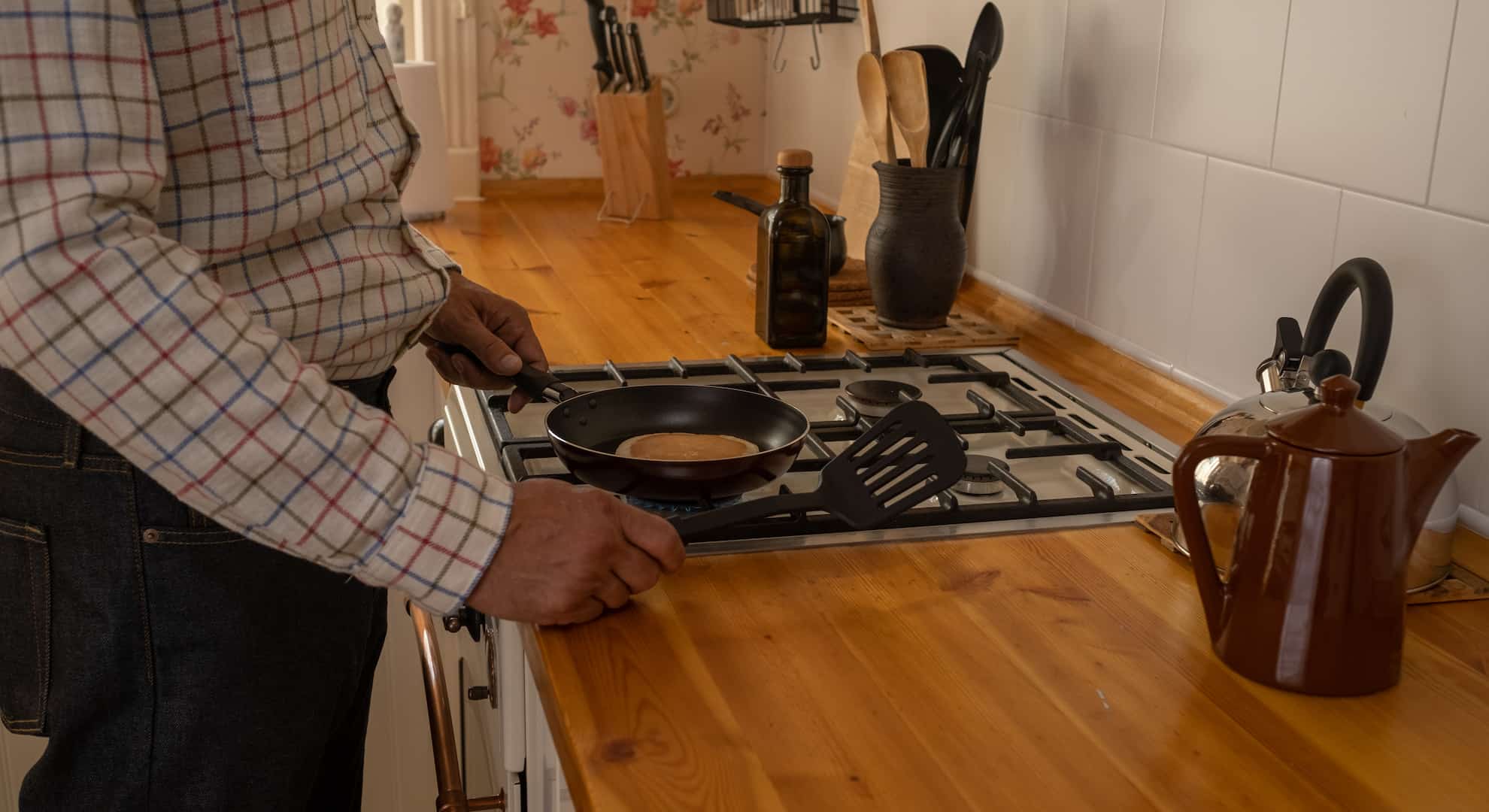 Person using a gas cooker