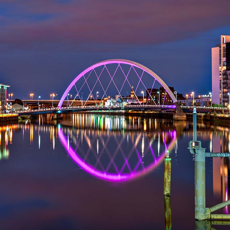 Photo of the Clyde Arc in Glasgow with pink lights at night