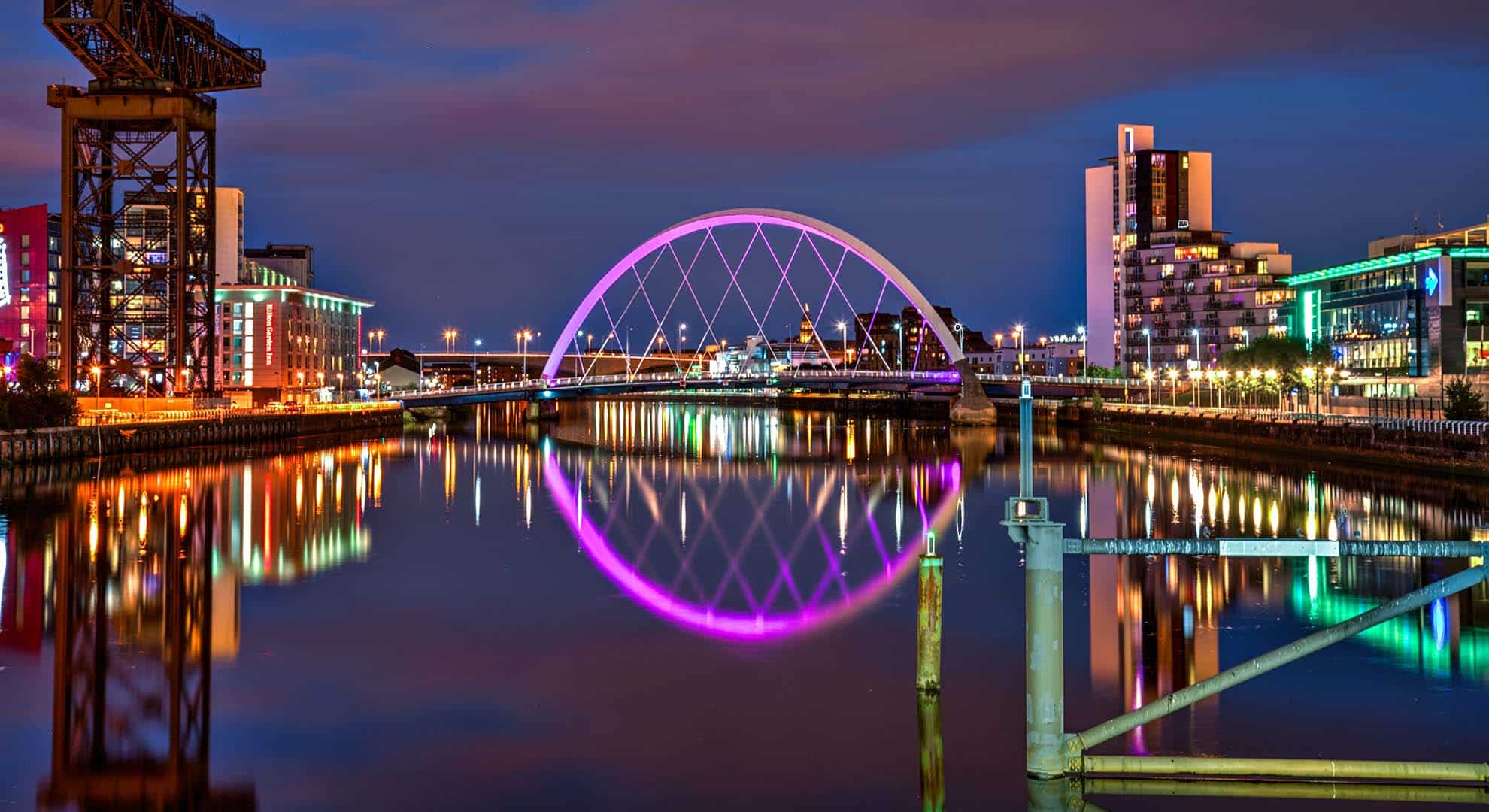 Photo of the Clyde Arc in Glasgow with pink lights at night