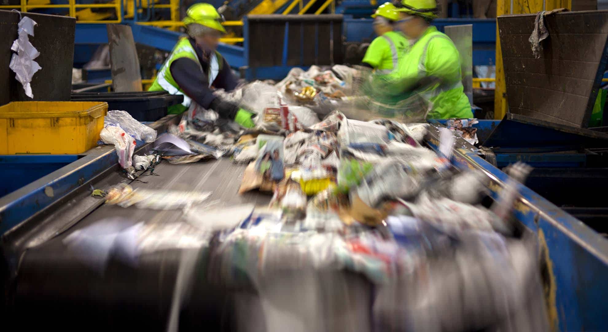 Photo of recycling on a conveyor belt in a materials recycling facility