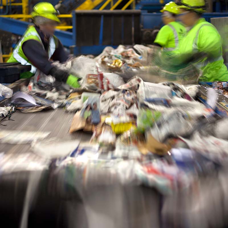 Photo of recycling on a conveyor belt in a materials recycling facility 