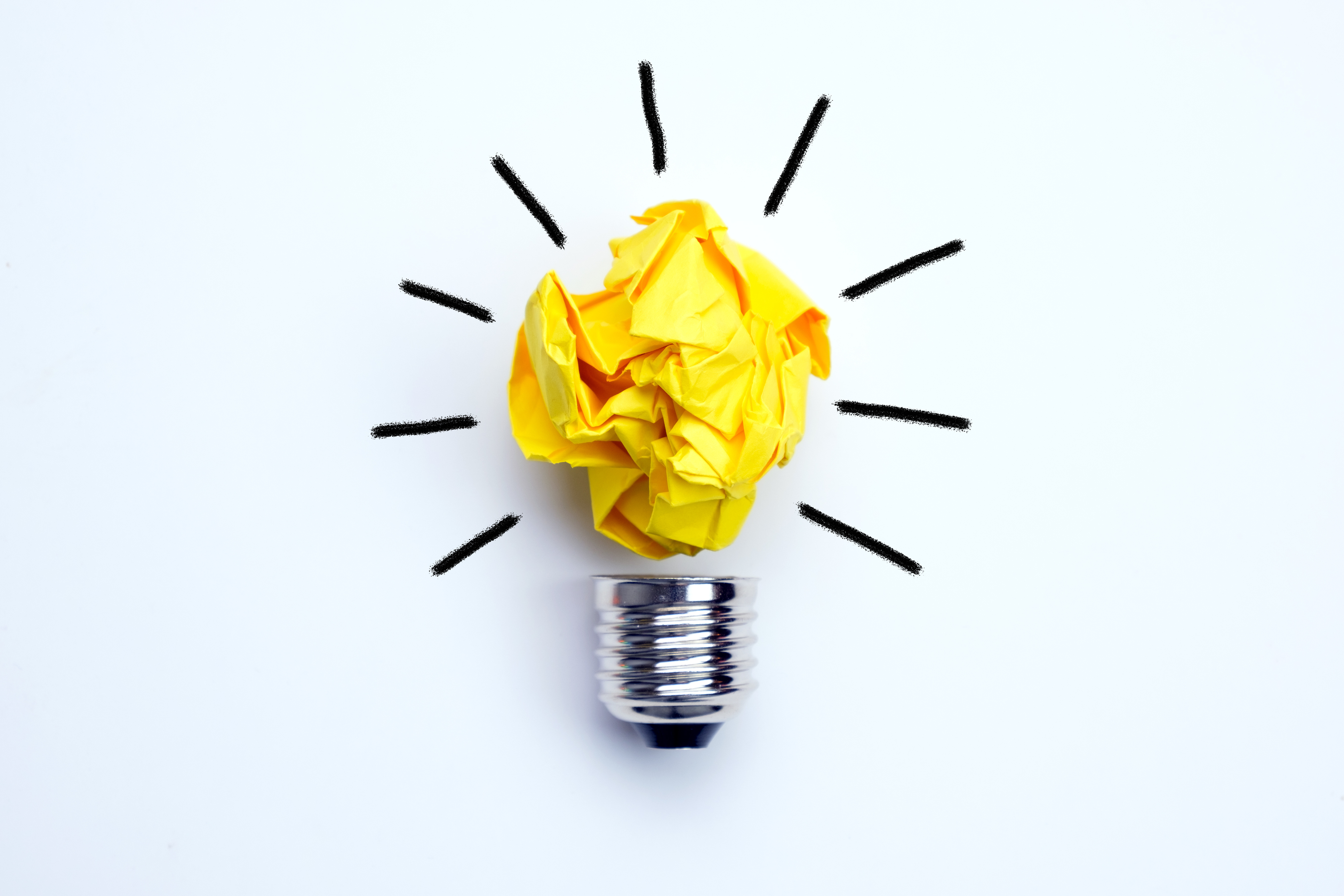 Illustration of a shining light bulb made from yellow folded paper