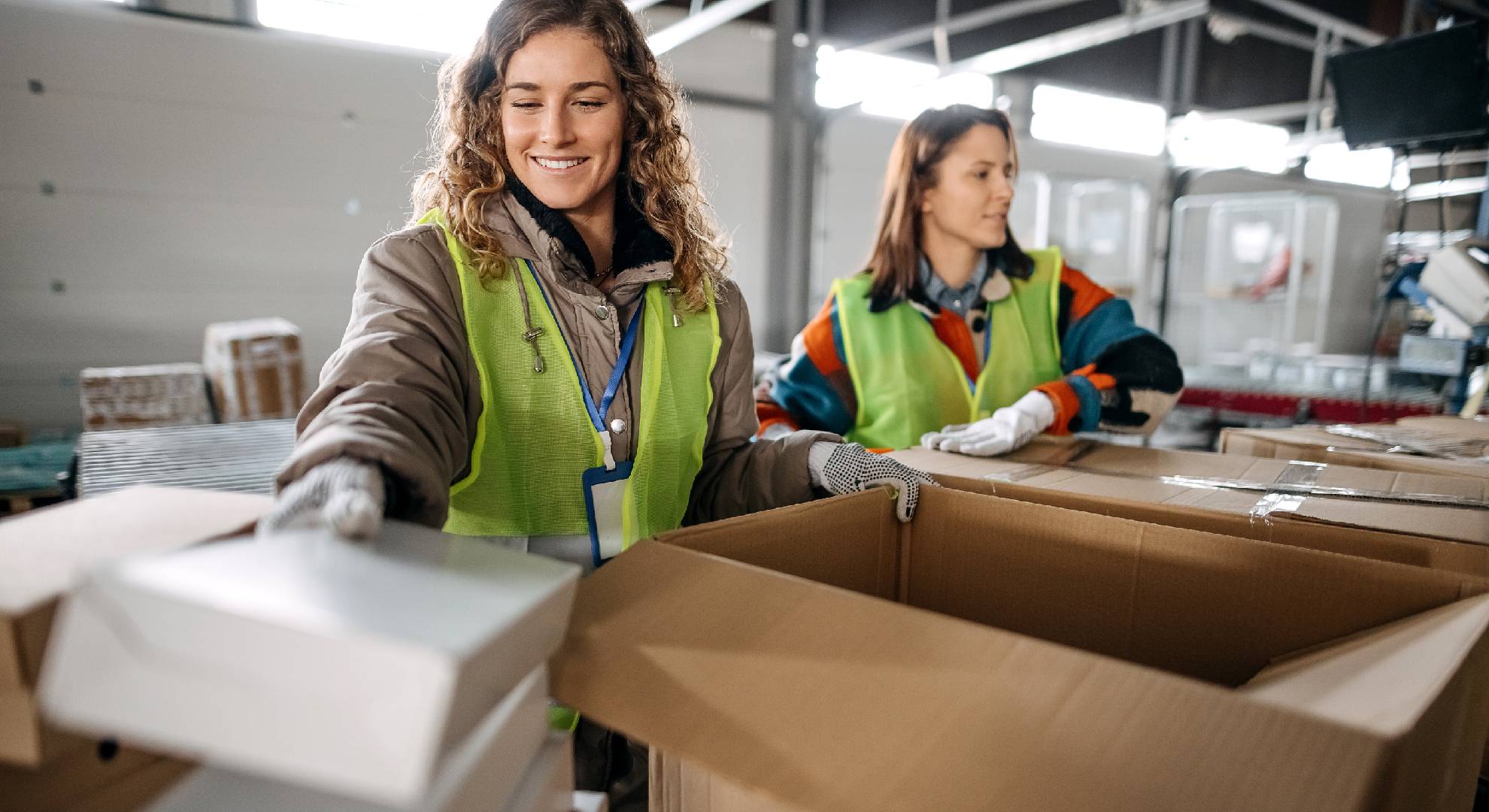 two-women-with-cardboard-packaging