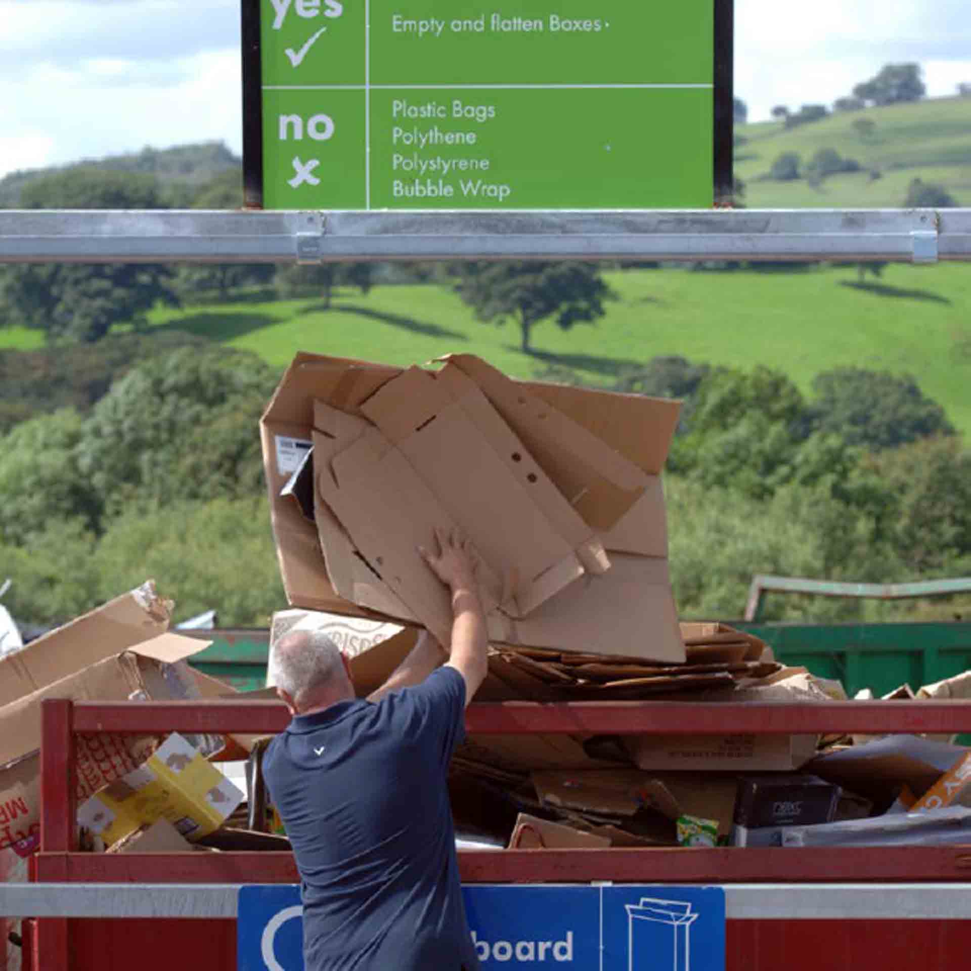 Photo of person at household waste recycling centre