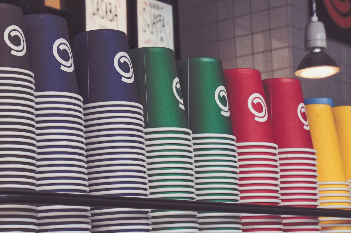 Stacks of multicolour disposable coffee cups
