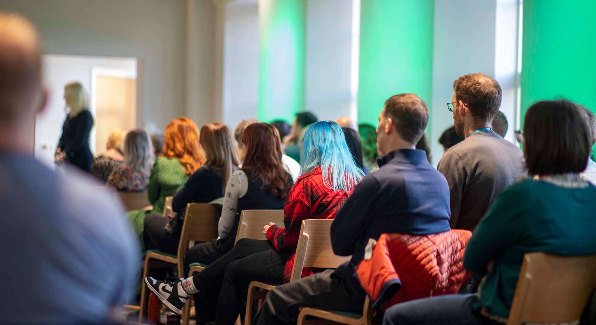 Photo of Zero Waste Scotland team members sitting in theatre style rows viewed from behind