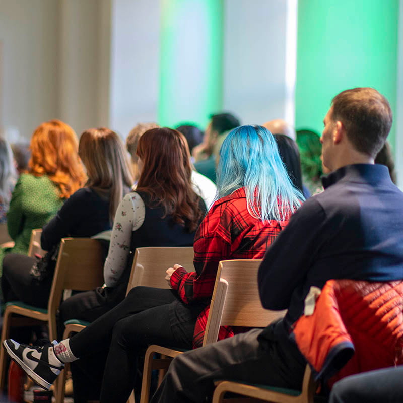 Photo of Zero Waste Scotland team members sitting in theatre style rows viewed from behind