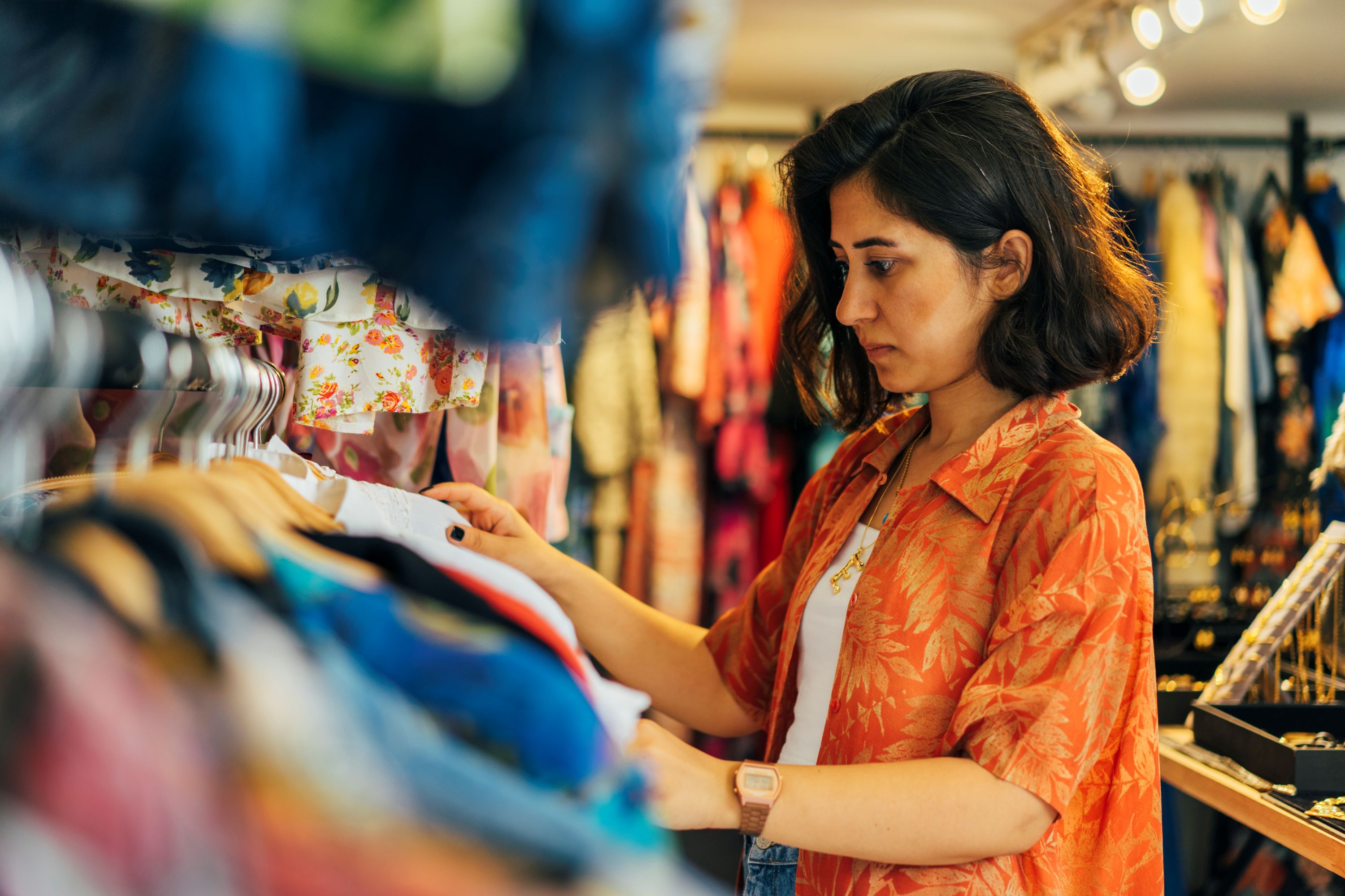 Woman browsing clothes in a shop