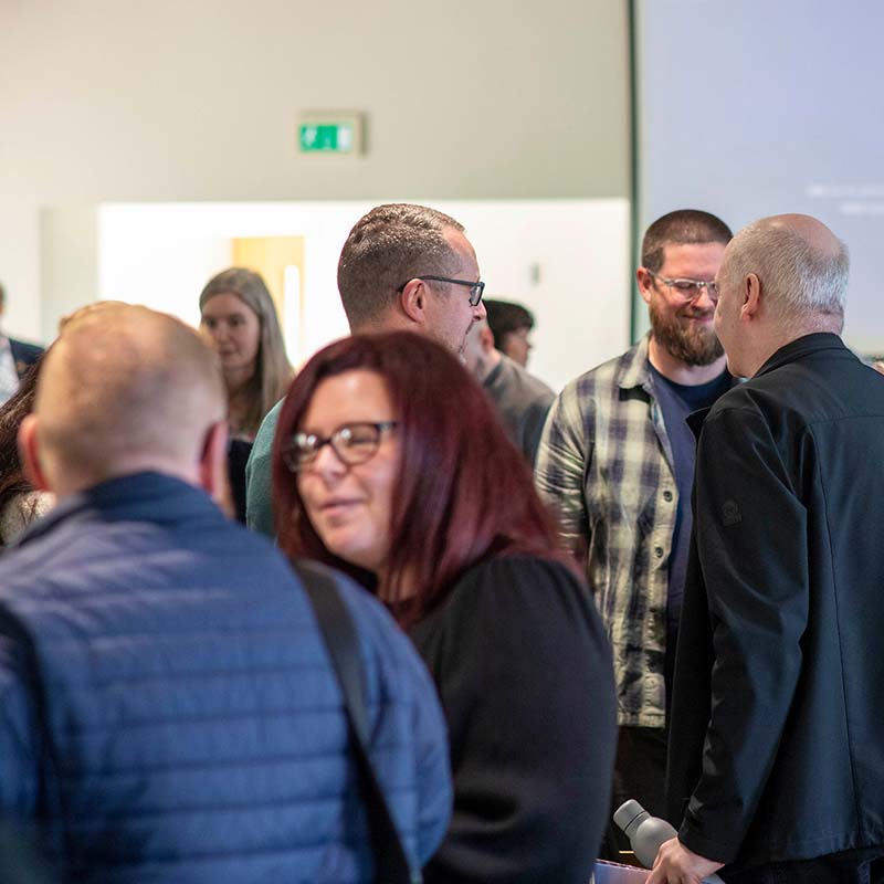 Photo of Zero Waste Scotland colleagues chatting after an All Colleague Update